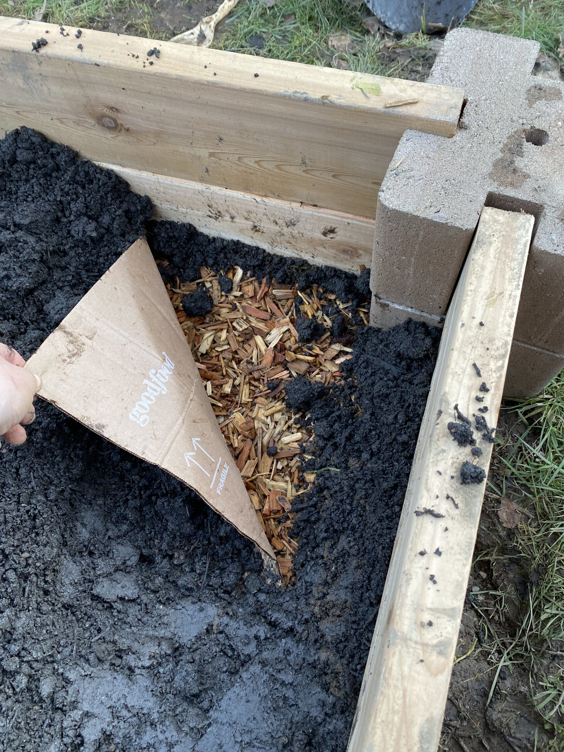 Woodchips in base of garden bed